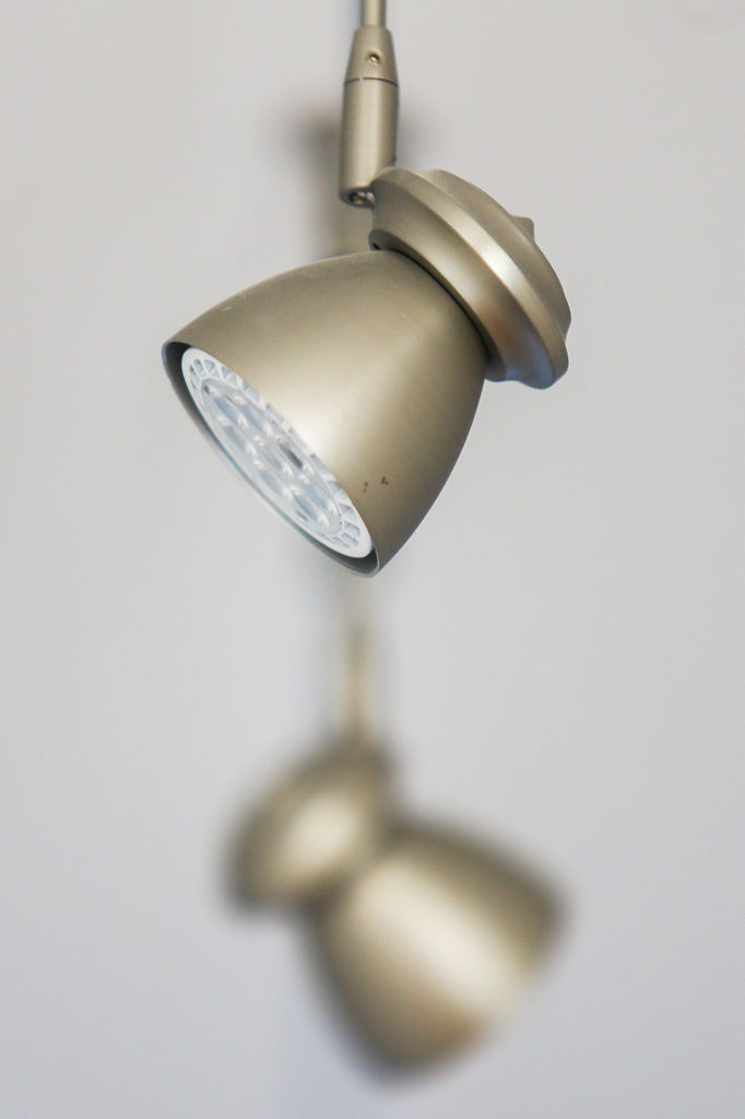 Overhead light fixtures hang from the ceiling
